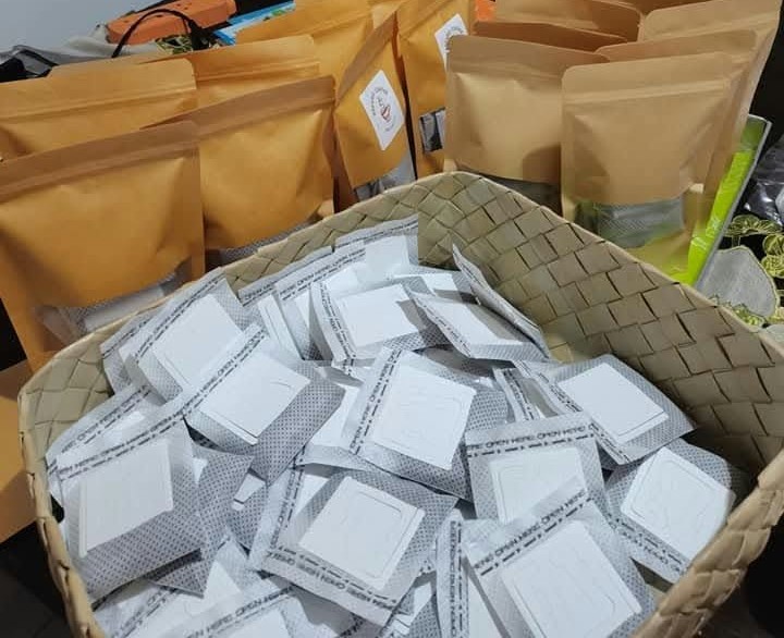 Packaged coffee, otap and toasted bread tubs arranged together